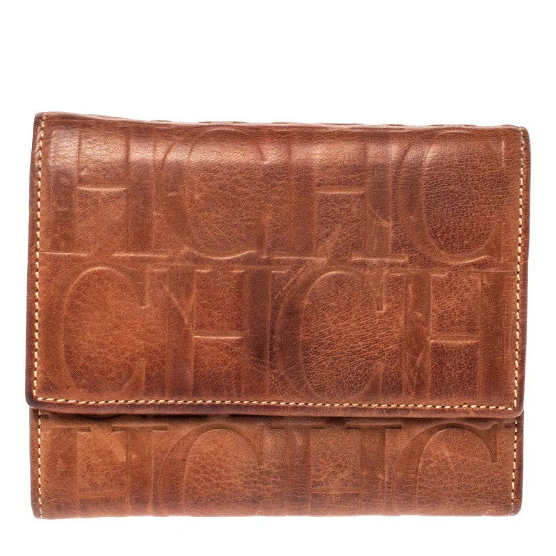 Women's money clip with a swarovski crystal accentCarolina Herrera Brown Embossed Leather Trifold Compact Wallet.. Women's money clip with a swarovski crystal accentCarolina Herrera Brown Embossed Leather Trifold Compact Wallet..