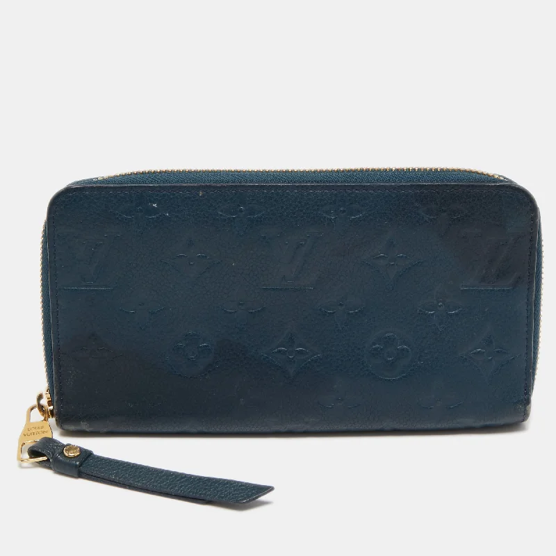 Women's leather money clip with embossed design​Louis Vuitton Orage Monogram Empreinte Leather Zippy Wallet..