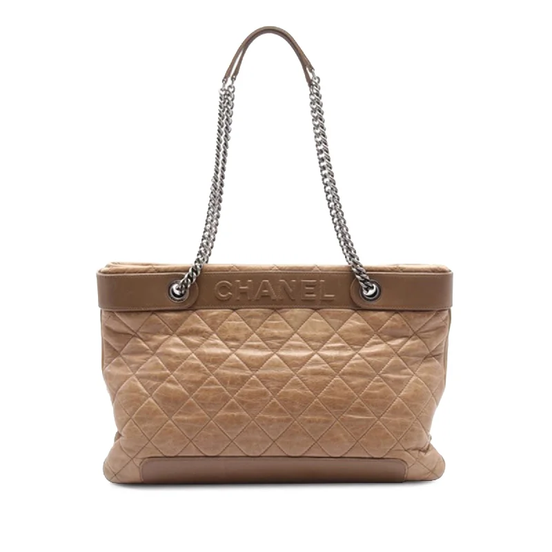 Metallic Tote Bag in Rose Gold with Chain Handles for a Glamorous Night OutBrown Chanel Quilted Crumpled Calfskin Tote Metallic Tote Bag in Rose Gold with Chain Handles for a Glamorous Night OutBrown Chanel Quilted Crumpled Calfskin Tote