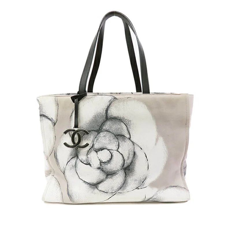 Quilted Tote Bag in Cream with Silver Hardware for a Classic and Sophisticated StyleGray Chanel Large Camellia Printed Canvas Shopper Tote Quilted Tote Bag in Cream with Silver Hardware for a Classic and Sophisticated StyleGray Chanel Large Camellia Printed Canvas Shopper Tote