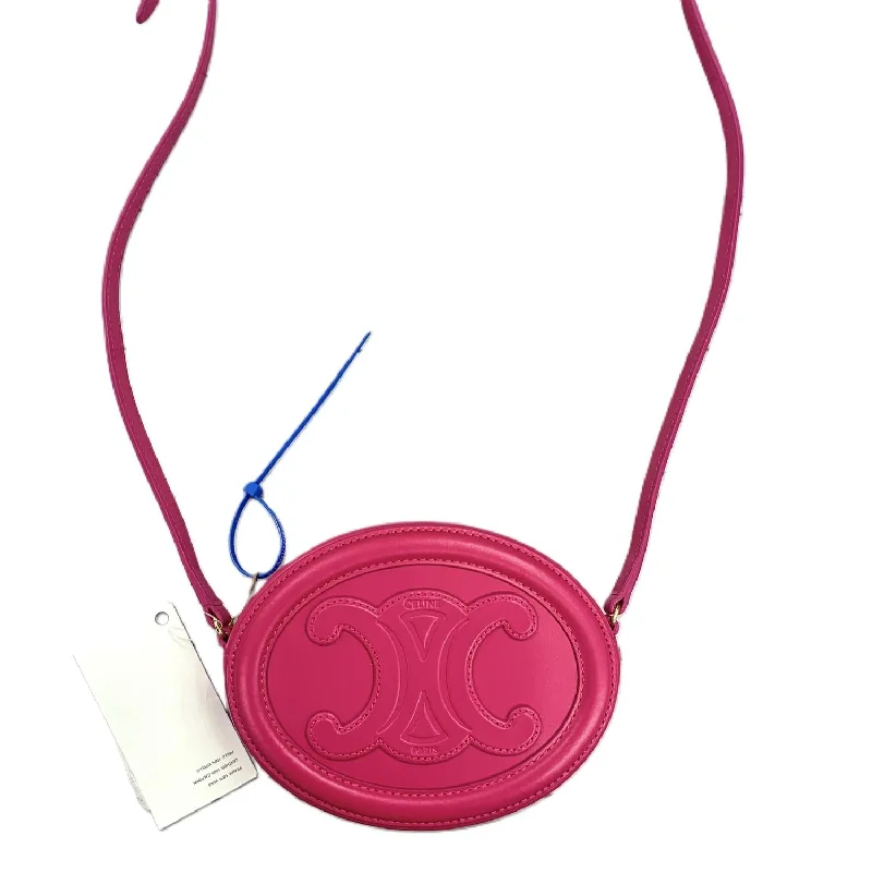 Metallic Crossbody Bag in Silver for New Year's Eve and Special CelebrationsPre-Loved Oval Triomphe Cuir Crossbody Bag In Hot Pink Metallic Crossbody Bag in Silver for New Year's Eve and Special CelebrationsPre-Loved Oval Triomphe Cuir Crossbody Bag In Hot Pink